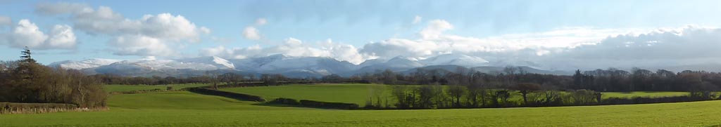 Snow on the mountains viewed from Llansadwrn near the weather station.