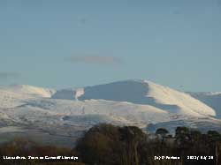 View of snow on Carnedd Llywelyn from llansadwrn.