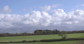 Almost clear over Anglesey with stratocumulus clouds remaining over Snowdonia on the afternoon of 5 October 2004 . Click to see larger image. 