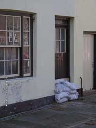  A sandbagged doorway in Beaumaris on the morning of 24th October 2004. Click to see larger image. 