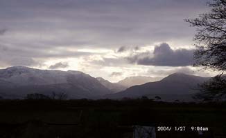 Light snow cover on Carneddau and Cwm Idwal on the morning of 27 January 2004. View from the weather station. Click to see larger image. 