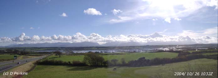 This is not a view of the Menai Strait but is a flooded Malltraeth Marsh on the morning of 26 October 2004. There is a line of stratocumulus clouds over the Snowdonia Mountains that are on the mainland to the S. Photo: ©: 2004 D. Perkins