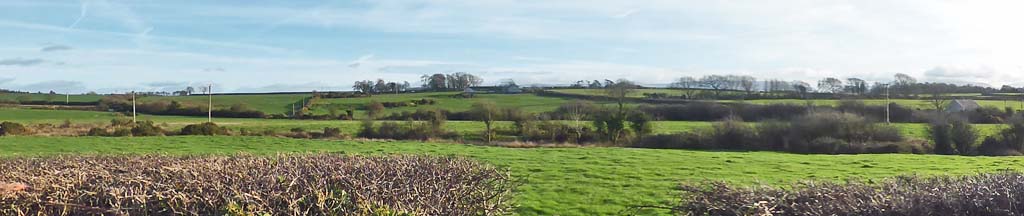 A fine sunny afternoon view SE in Llansadwrn on footpath to Mynydd Llwyddiarth from the church.
