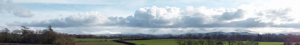 Snowclad Snowdonia Mountains from Llansadawrn.