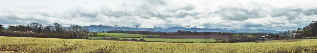 View of snow clad Snowdonia from Llansadawrn.