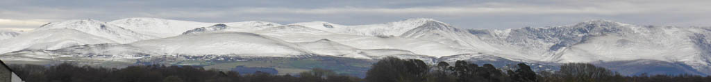 Snow on the Carneddau Mountains outlines enhanced by windblow.